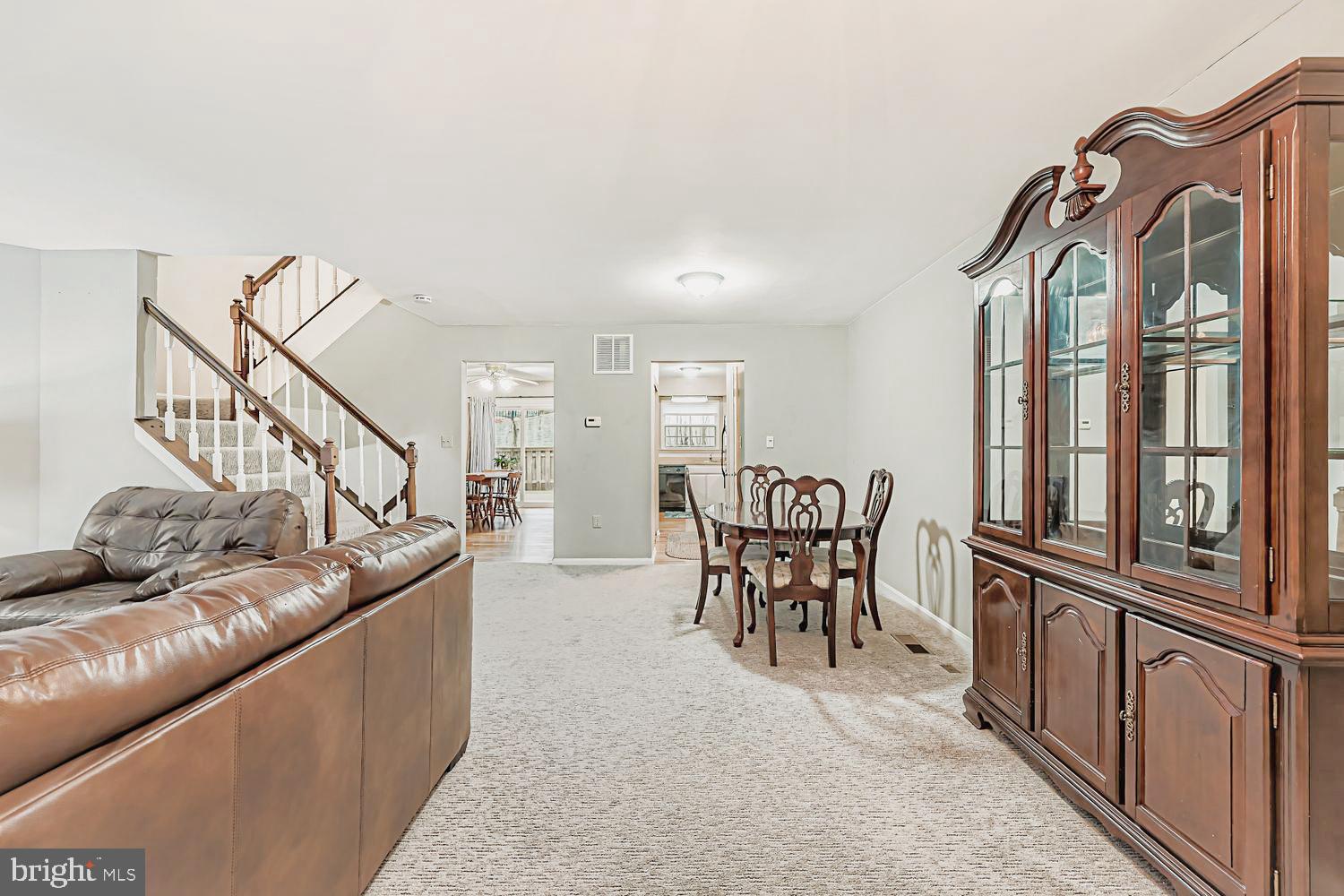 13229 Country Ridge Drive Germantown, MD 20874 - Photo 2 of 24 a living room with furniture with a dining table