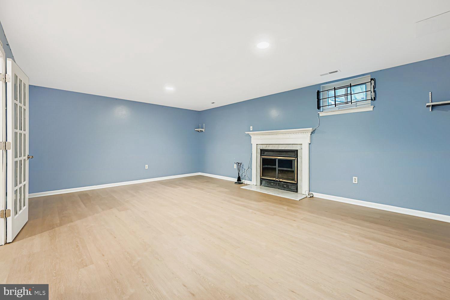 13229 Country Ridge Drive Germantown, MD 20874 - Photo 21 of 24 a view of an empty room with a fireplace and a window