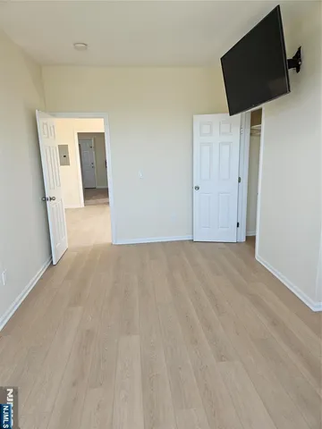 a view of a livingroom with wooden floor