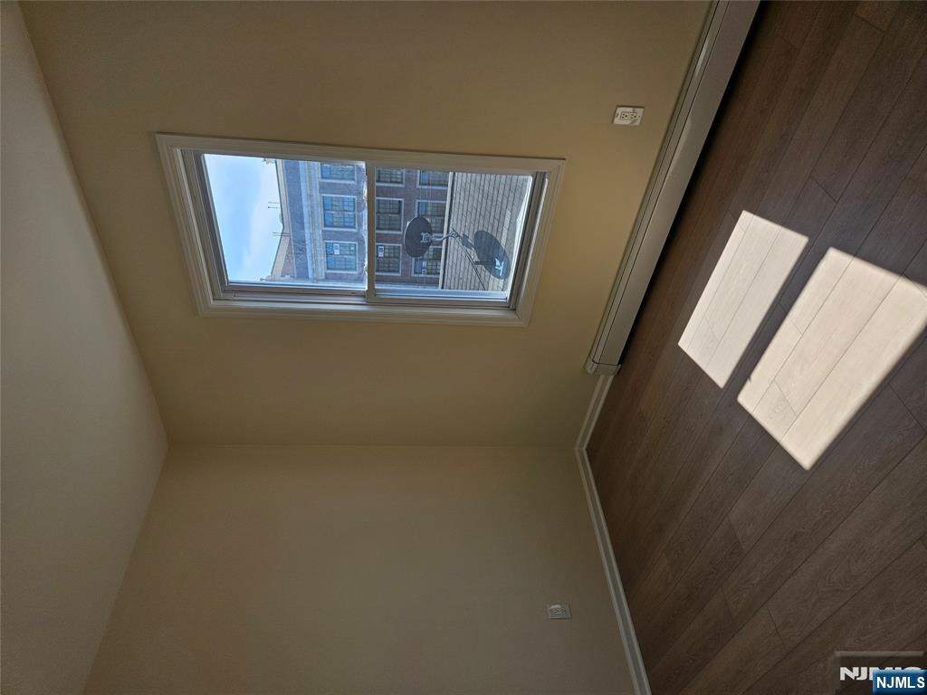 372 Bergen Street Newark, NJ 07103 - Photo 27 of 29 an empty room with wooden floor and windows