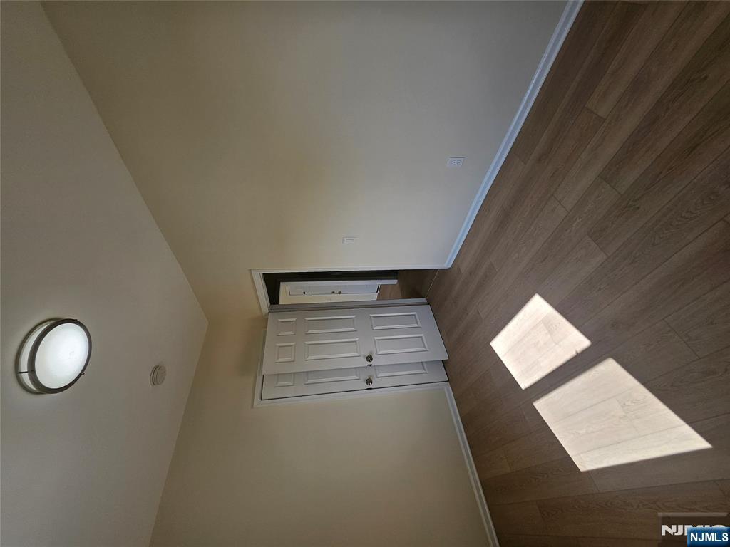 372 Bergen Street Newark, NJ 07103 - Photo 29 of 29 an empty room with wooden floor and windows