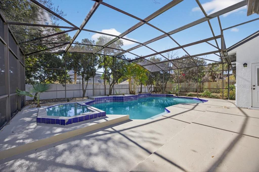 8618 Valley Ridge Court Orlando, FL 32818 - Photo 20 of 24 a view of a backyard