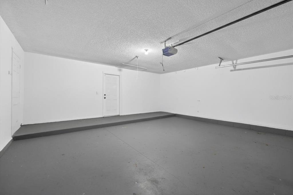 8618 Valley Ridge Court Orlando, FL 32818 - Photo 22 of 24 an empty room with a empty space and windows