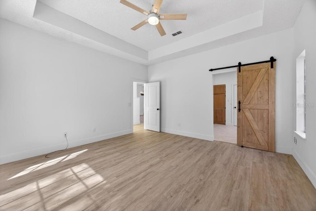 8618 Valley Ridge Court Orlando, FL 32818 - Photo 5 of 24 wooden floor in an empty room