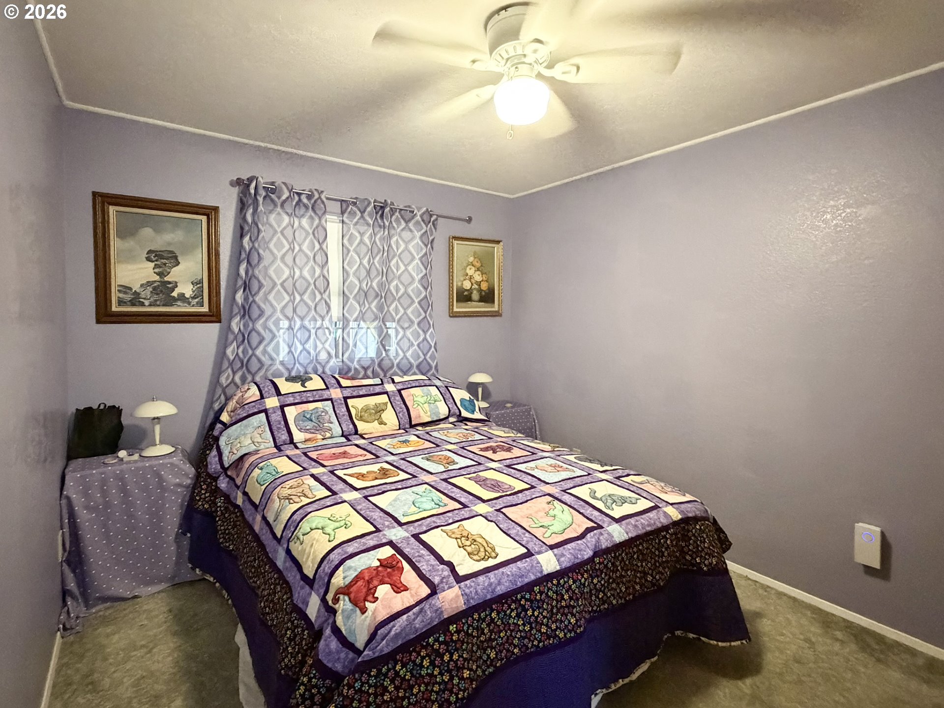 1372 Hampton Road Brookings, OR 97415 - Photo 17 of 42 a bedroom with a bed and painting on the wall