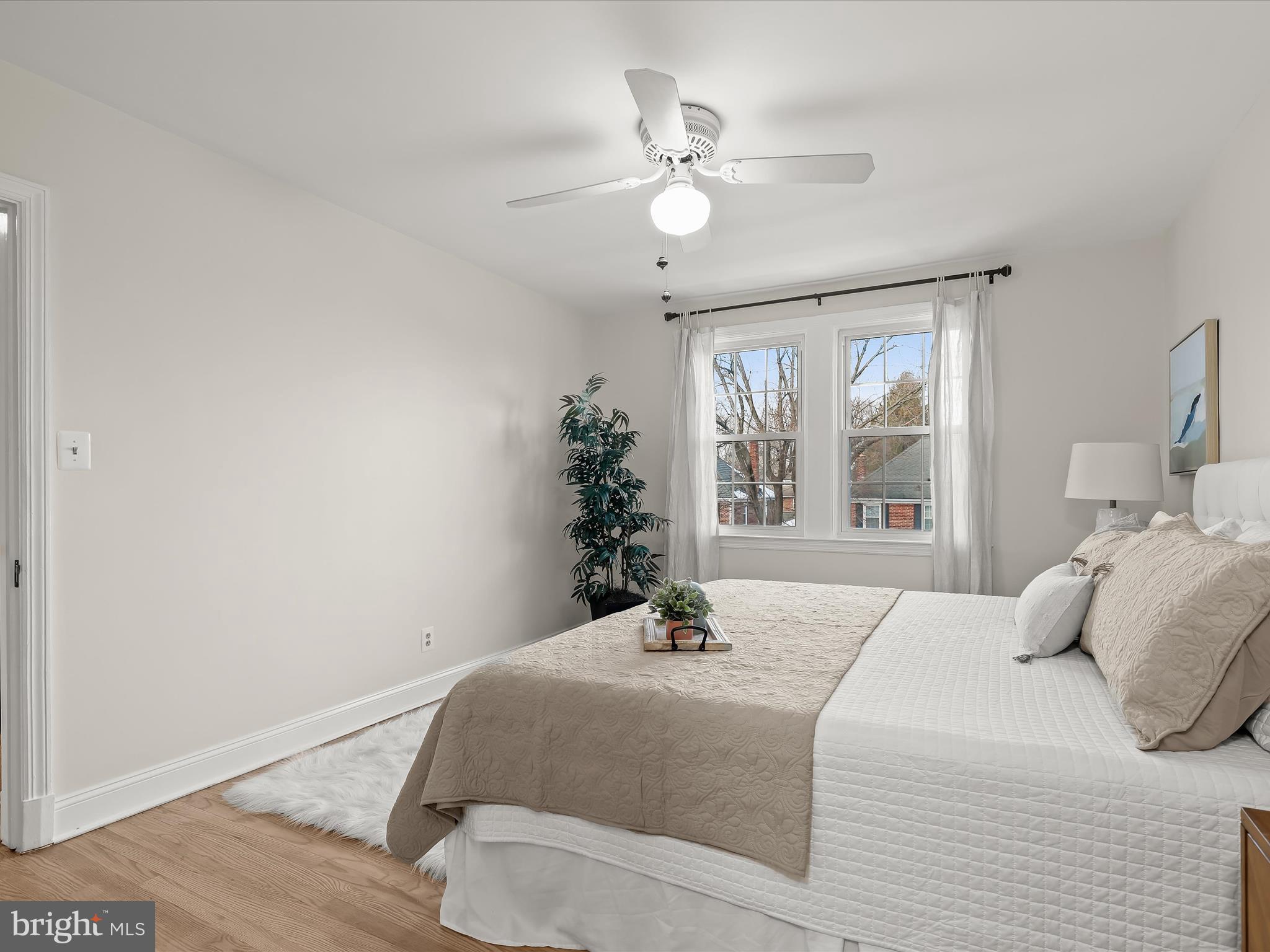 317 Overbrook Road Baltimore, MD 21212 - Photo 28 of 52 a bedroom with a large bed and a chandelier