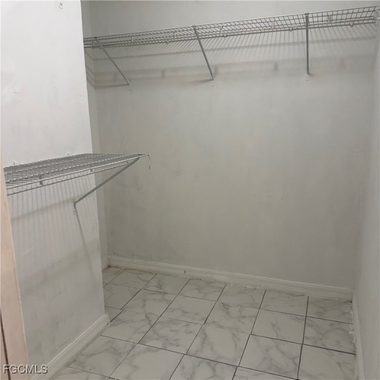 2172 Simon Court Fort Myers, FL 33916 - Photo 11 of 15 a view of a room with racks on the wall