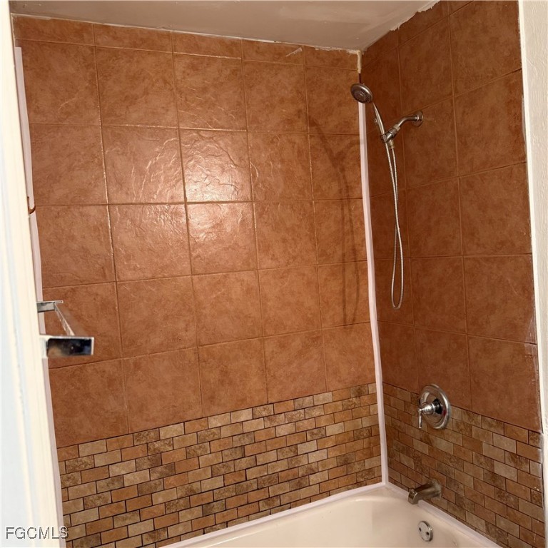 2172 Simon Court Fort Myers, FL 33916 - Photo 12 of 15 a bathroom with a shower