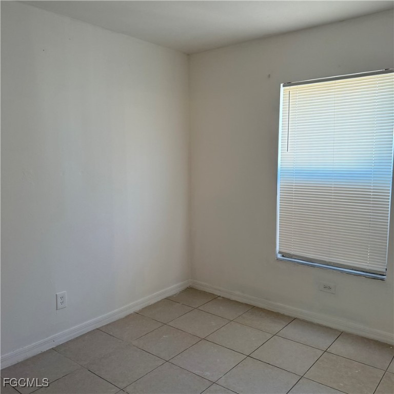 2172 Simon Court Fort Myers, FL 33916 - Photo 7 of 15 an empty room with a window