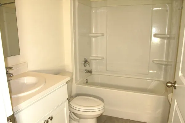 a bathroom with a sink a toilet and a bathtub