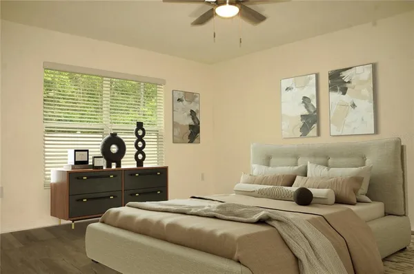 a bedroom with a bed and a window