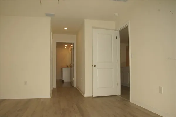 a view of a hallway with closet area
