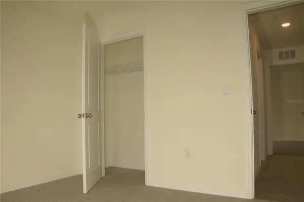 a view of a hallway with closet