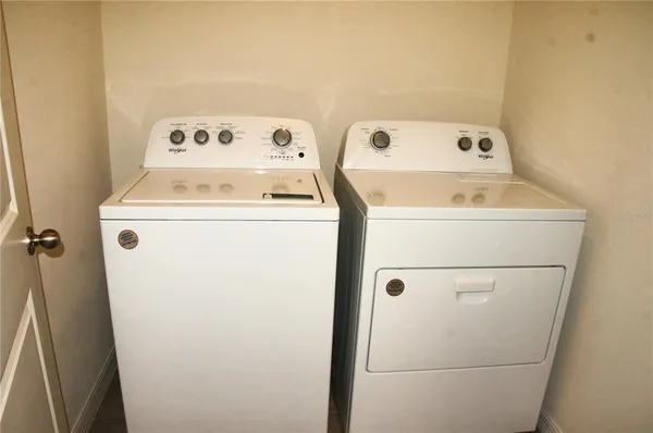 a utility room with dryer and washer