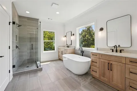 an empty room with closet and windows