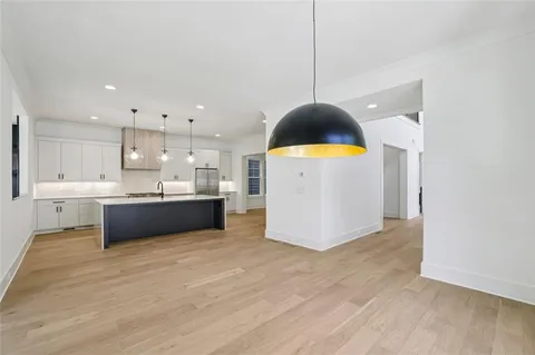 a kitchen with a sink cabinets and window