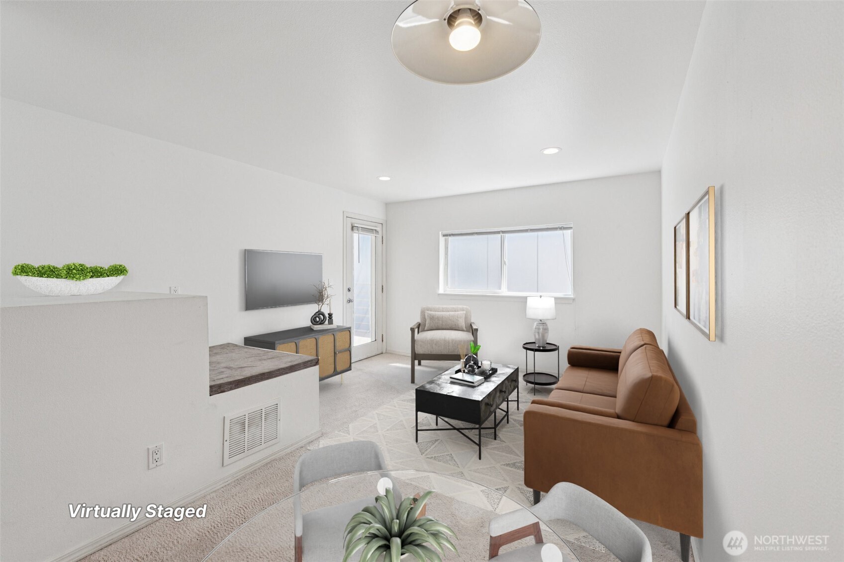 5624 Roosevelt Way Northeast, Unit 202 Seattle, WA 98105 - Photo 2 of 21 a living room with furniture and a flat screen tv