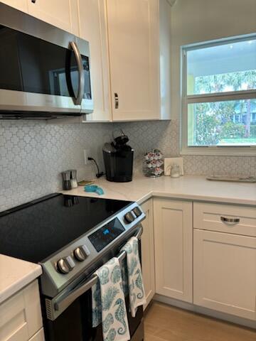 4404 Southeast Mulford Lane Stuart, FL 34997 - Photo 11 of 22 4404 MULFORD APPLIANCES KITCHEN IMG_0060