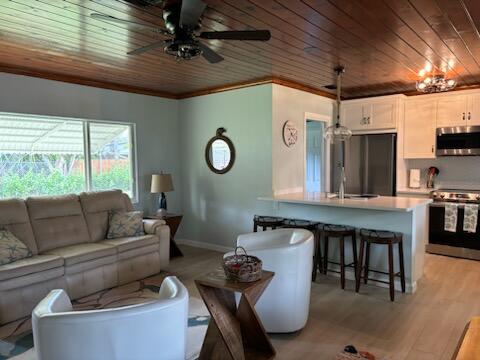 4404 Southeast Mulford Lane Stuart, FL 34997 - Photo 16 of 22 4404 MULFORD LIVING ROOM IMG_0094 4