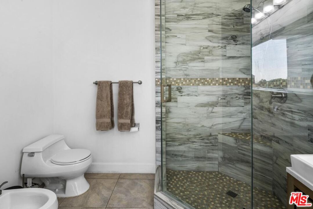 6696 Lakeridge Road Los Angeles, CA 90068 - Photo 14 of 19 a bathroom with a toilet and a shower