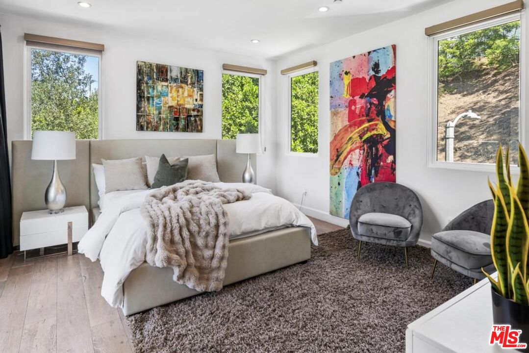 6696 Lakeridge Road Los Angeles, CA 90068 - Photo 16 of 19 a bedroom with a bed and a window