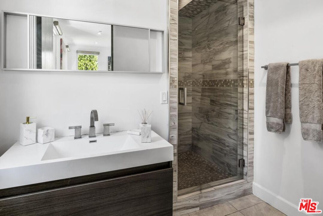 6696 Lakeridge Road Los Angeles, CA 90068 - Photo 17 of 19 a bathroom with a sink and a mirror