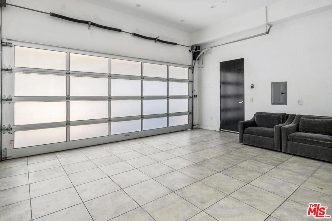 6696 Lakeridge Road Los Angeles, CA 90068 - Photo 19 of 19 a view of a livingroom with furniture and a window