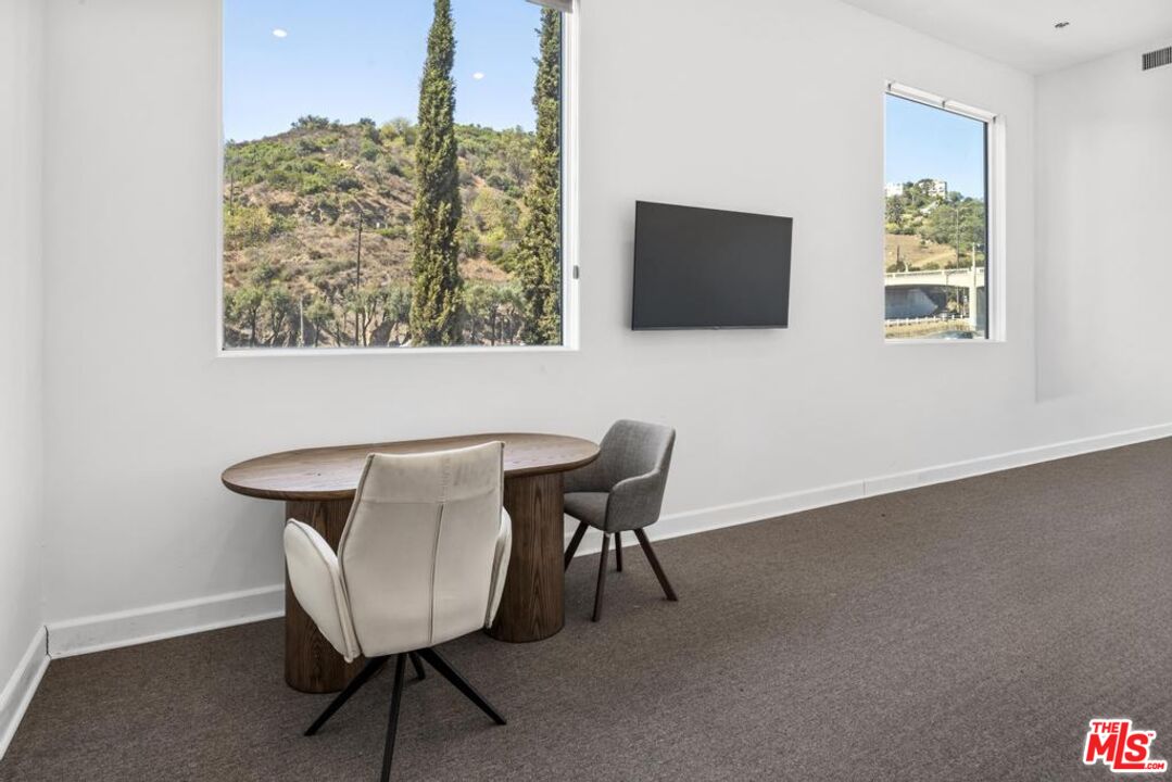6696 Lakeridge Road Los Angeles, CA 90068 - Photo 6 of 19 a view of a livingroom with furniture and a flat screen tv