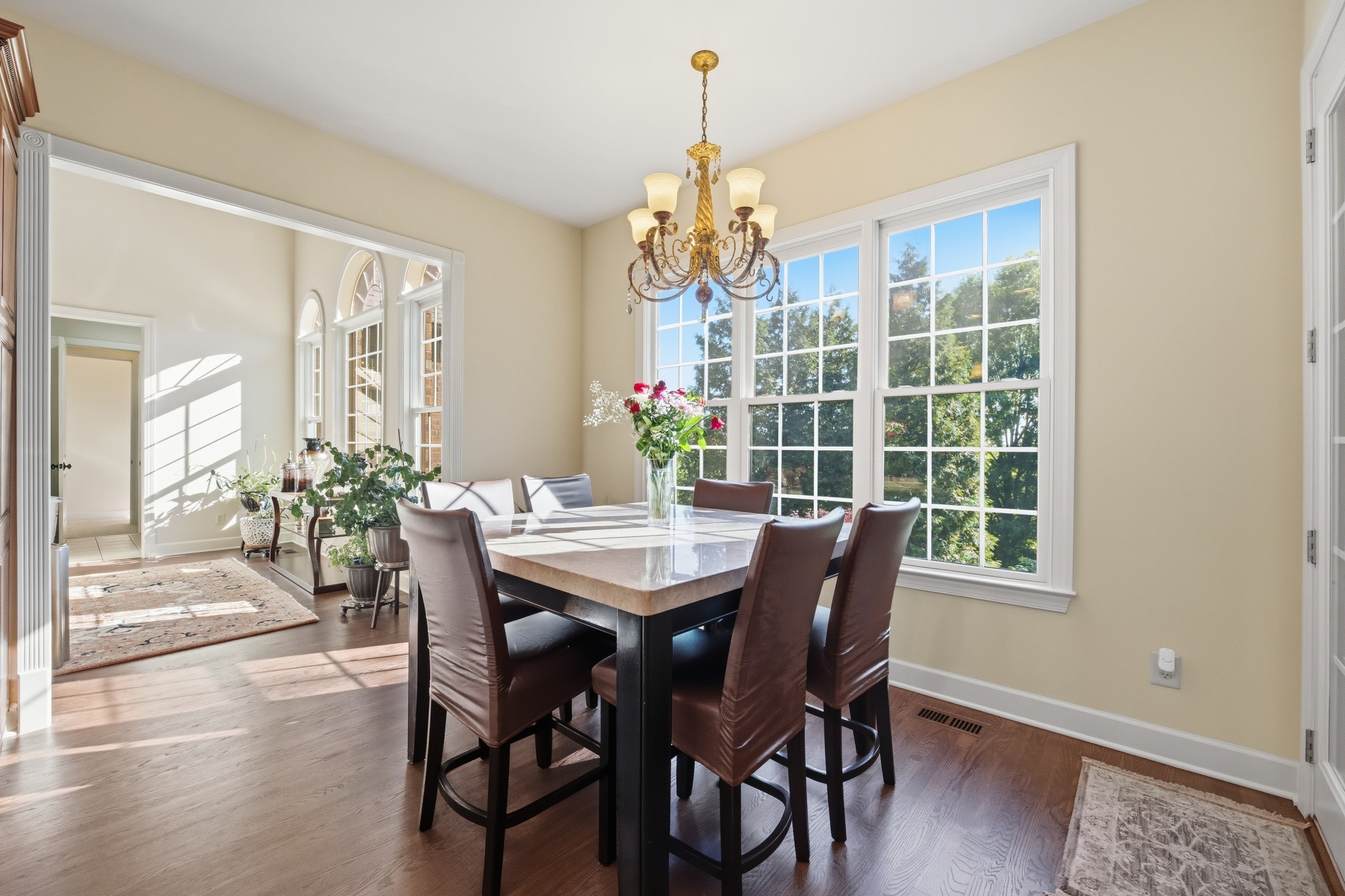 319 Hamlets End Way Franklin, TN 37067 - Photo 20 of 54 a view of a dining room with furniture window and wooden floor
