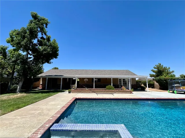 a view of house with yard