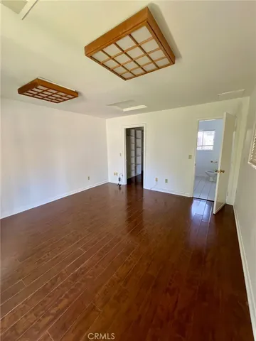 a bathroom with a sink toilet and mirror
