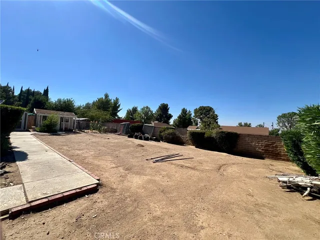 a view of a chairs and table in patio