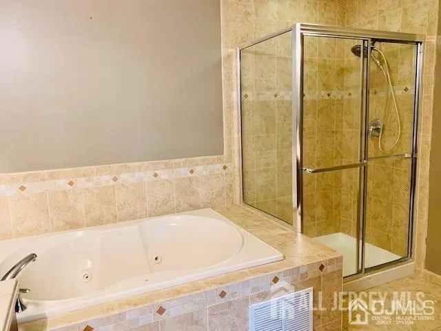 a bathroom with a sink vanity and a mirror