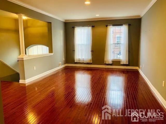 a view of an entryway with wooden floor