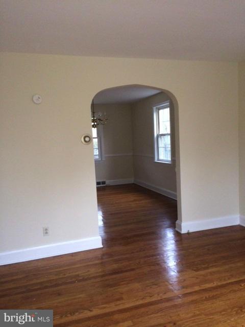 428 Overbrook Road Baltimore, MD 21212 - Photo 3 of 13 a view of empty room with wooden floor and fan