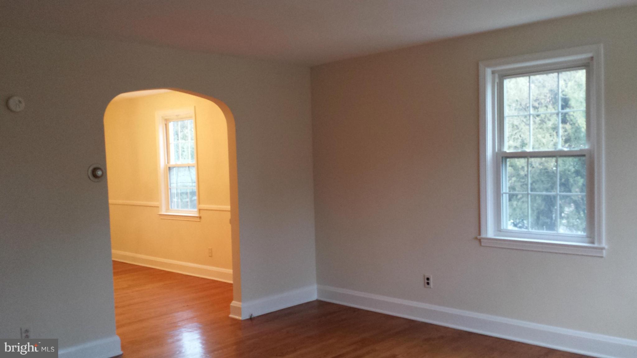 428 Overbrook Road Baltimore, MD 21212 - Photo 4 of 13 a view of empty room with wooden floor and fan