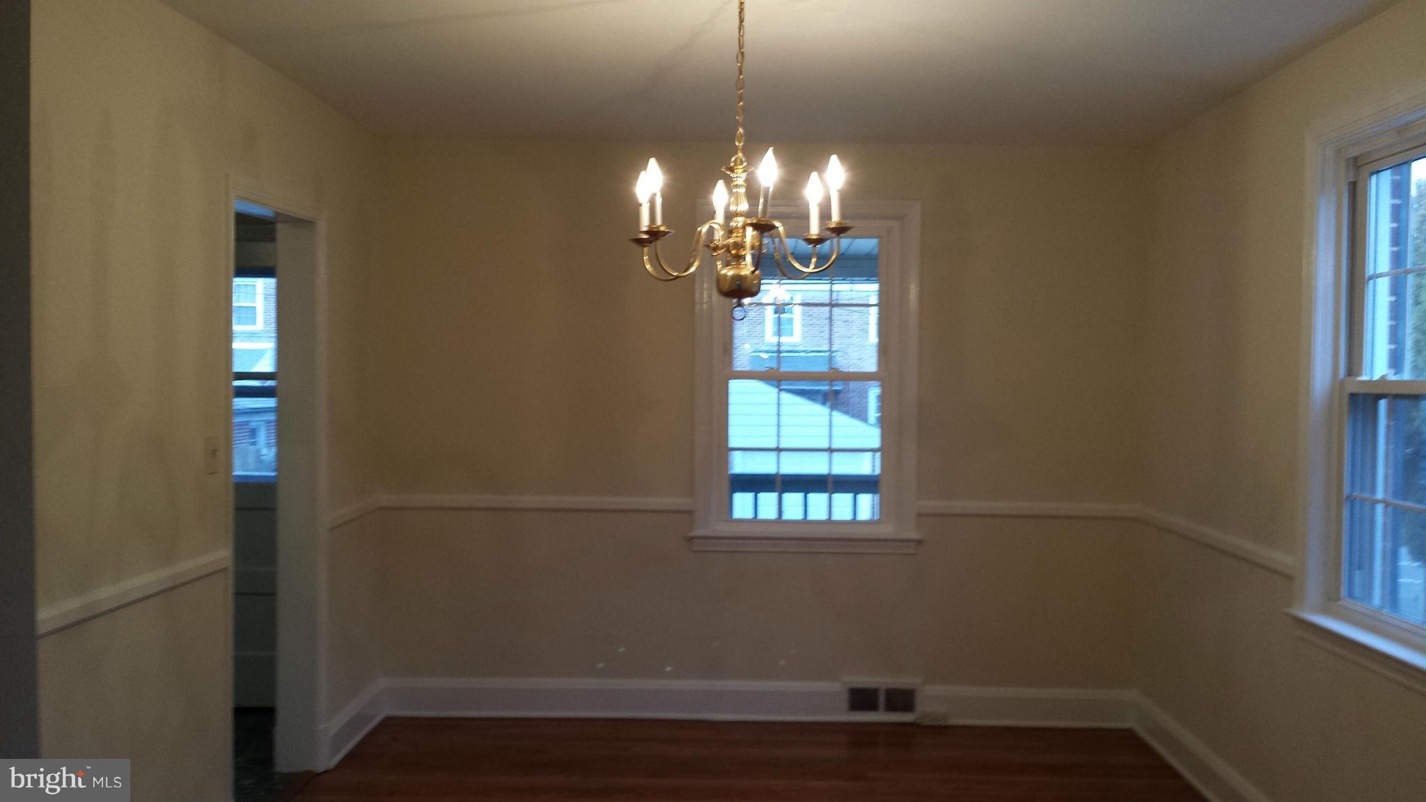 428 Overbrook Road Baltimore, MD 21212 - Photo 7 of 13 a view of empty room with wooden floor and fan