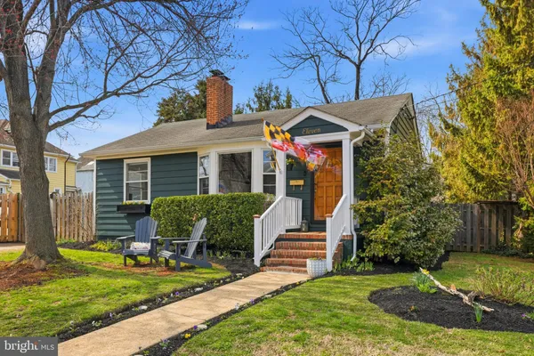 a view of a house with a yard porch and sitting area