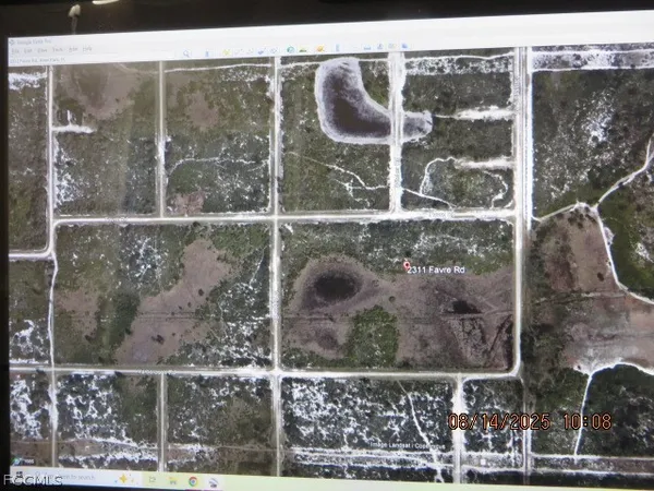 a bathroom with a glass shower door and garden