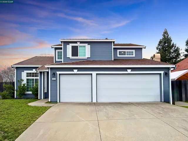 a house view with a backyard space