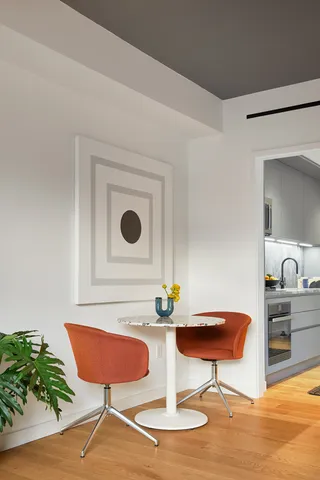 a view of a living room and a balcony