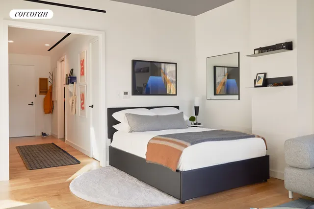 a bedroom with a bed and a couch