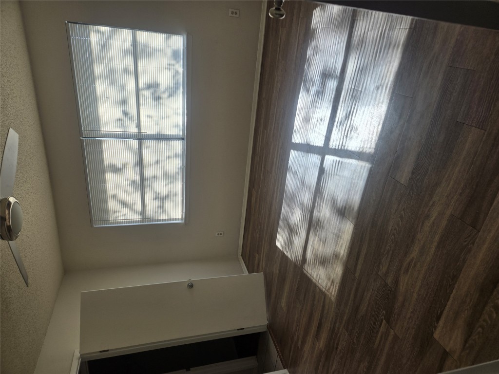 2903 West Slaughter Lane, Unit B Austin, TX 78748 - Photo 14 of 20 a view of empty room with wooden floor and fan
