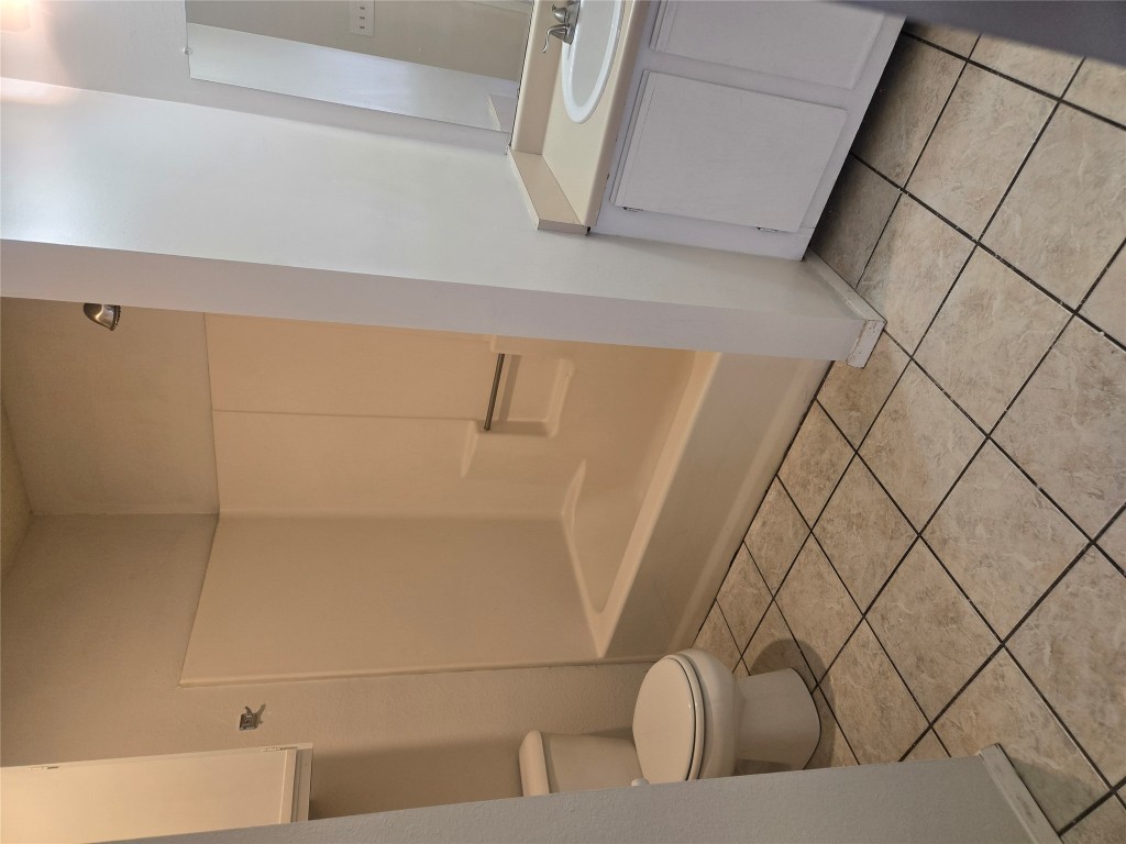 2903 West Slaughter Lane, Unit B Austin, TX 78748 - Photo 17 of 20 a bathroom with a sink and a vanity