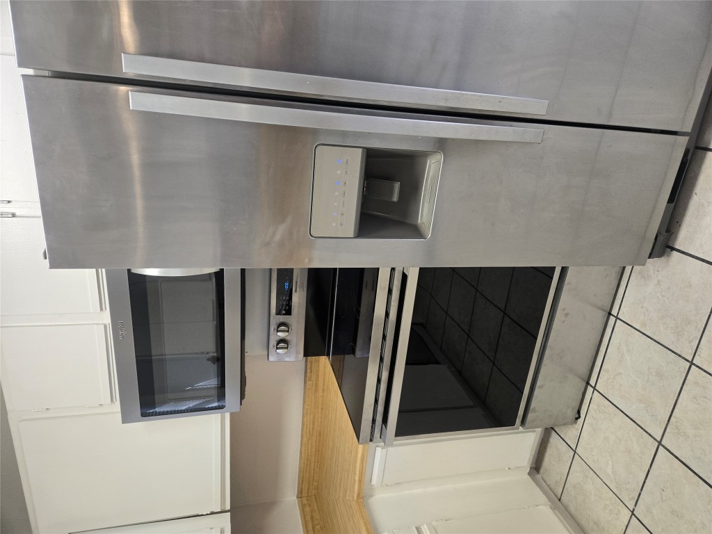 2903 West Slaughter Lane, Unit B Austin, TX 78748 - Photo 5 of 20 a kitchen with granite countertop cabinets and steel stainless steel appliances