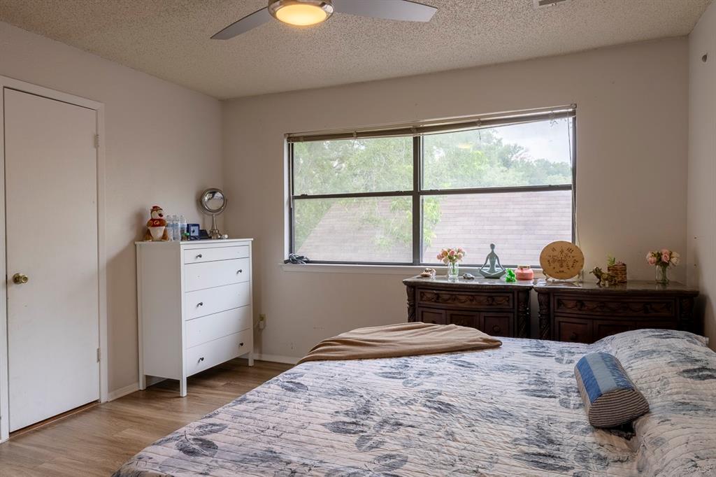 2903 West Slaughter Lane, Unit B Austin, TX 78748 - Photo 7 of 9 a bedroom with a bed and a window