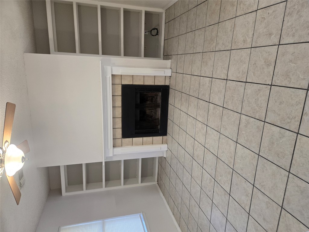 2903 West Slaughter Lane, Unit B Austin, TX 78748 - Photo 9 of 20 a view of an empty room with a fireplace