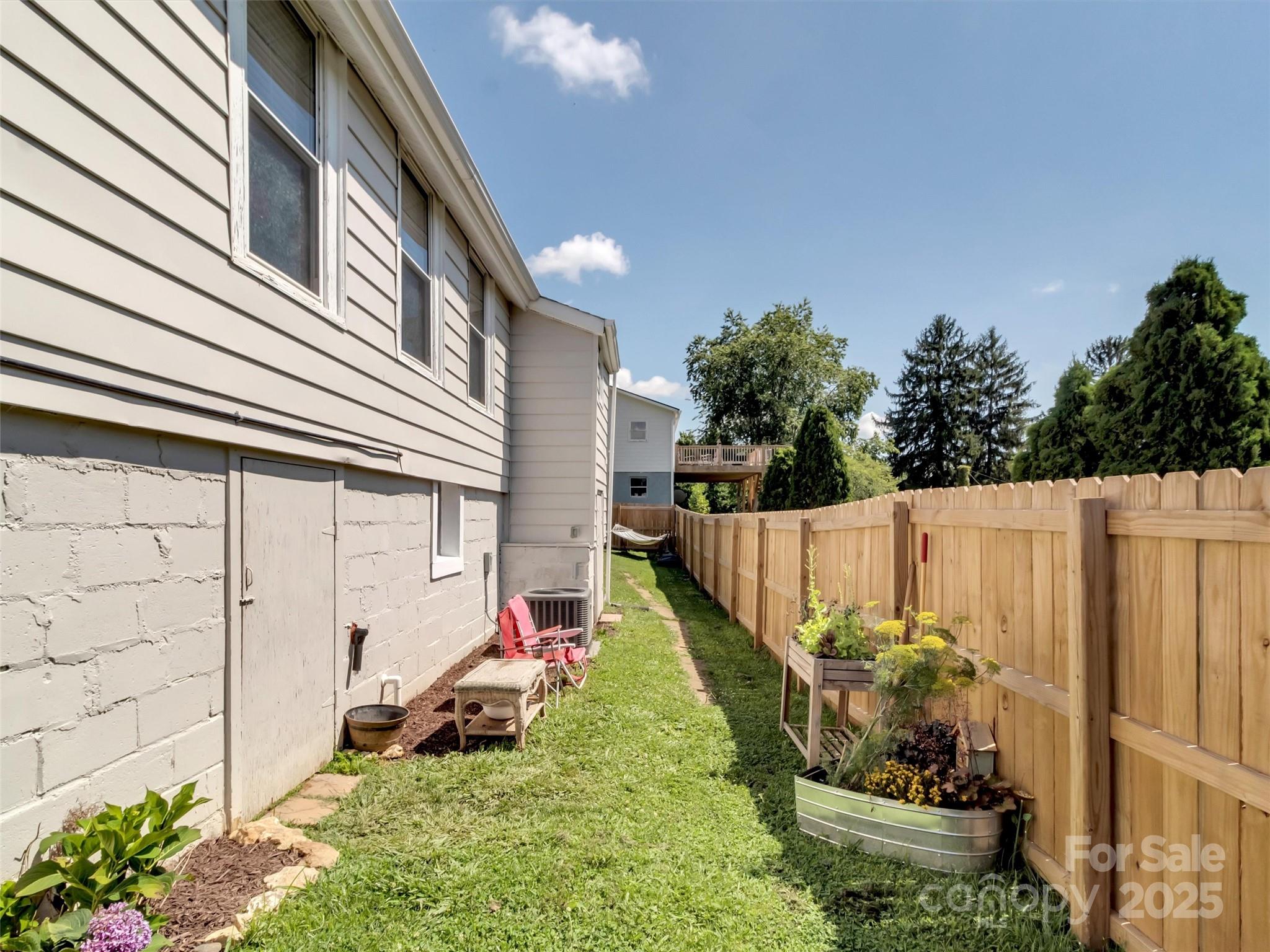 82 Elizabeth Street Canton, NC 28716 - Photo 17 of 17 a view of a chair and tables in the backyard