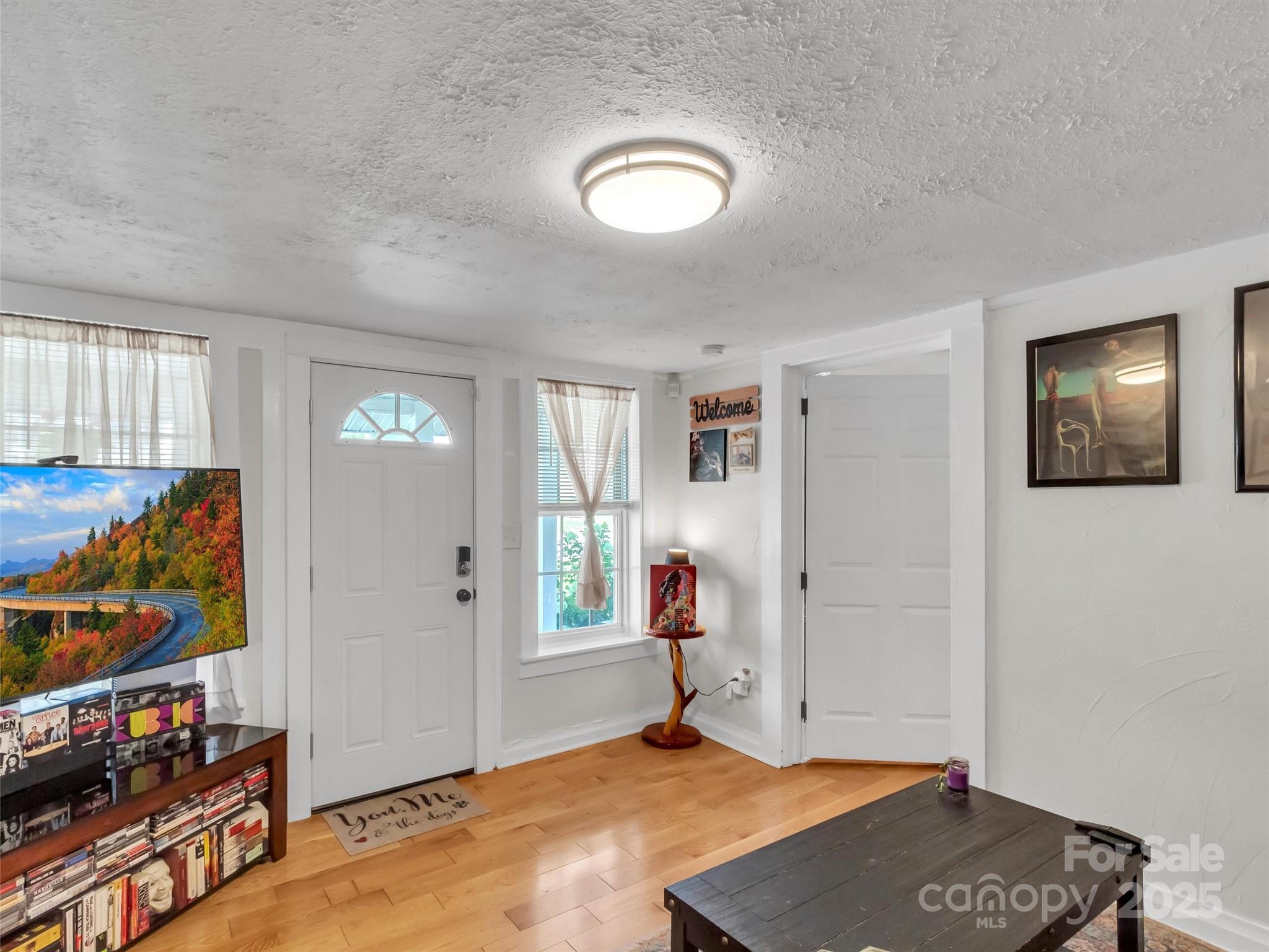 82 Elizabeth Street Canton, NC 28716 - Photo 2 of 17 a view of an empty room and window