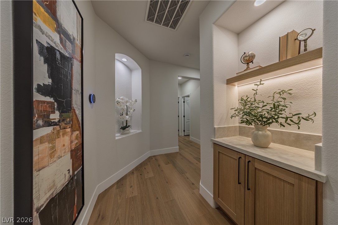 8800 Lusso Las Vegas, NV 89134 - Photo 38 of 85 Hallway with light wood-style floors and baseboards